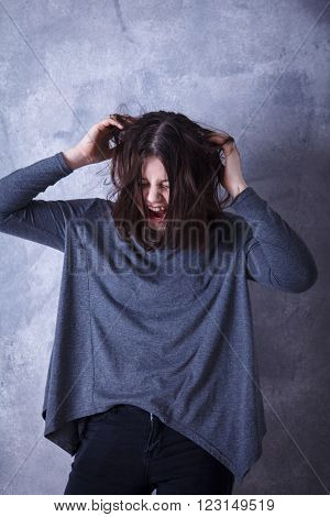Teen Girl In Studio Posing On A Dark Background