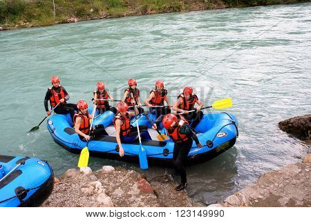 Foca, Bosnia: jun 2. 2015. Group of happy people with guide whitewater rafting and rowing on river
** Note: Visible grain at 100%, best at smaller sizes