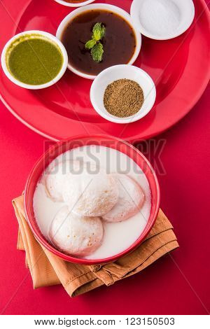 dahi vada or dahi vade also known as Curd Vadai in South India, a popular snack famous all over India prepared by soaking lentil vadas in thick dahi or yogurt, topped with spicy & sweet chutney etc