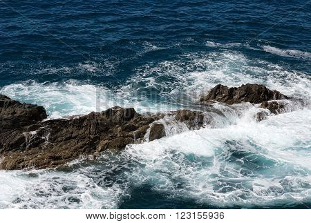 Wave Splashing Over A Rock On Caleta Negra Beach In Ajuy On Fuerteventura. Canary Island Spain