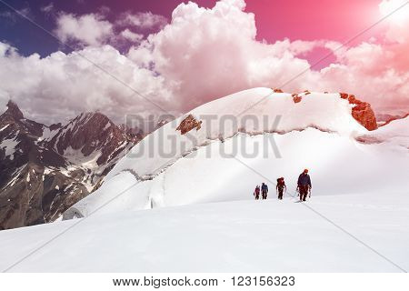 Four Members Team Sport Clothing Going Climbing Gear Up  Mountain Peaks Blue Sky Majestic Summits Shining Sun Background Himalaya