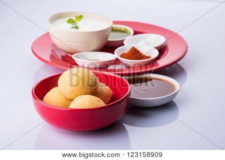 dahi vada or dahi vade also known as Curd Vadai in South India, a popular snack famous all over India prepared by soaking lentil vadas in thick dahi or yogurt, topped with spicy & sweet chutney etc