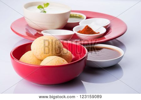 dahi vada or dahi vade also known as Curd Vadai in South India, a popular snack famous all over India prepared by soaking lentil vadas in thick dahi or yogurt, topped with spicy & sweet chutney etc