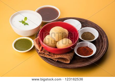 dahi vada or dahi vade also known as Curd Vadai in South India, a popular snack famous all over India prepared by soaking lentil vadas in thick dahi or yogurt, topped with spicy & sweet chutney etc