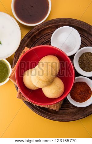 dahi vada or dahi vade also known as Curd Vadai in South India, a popular snack famous all over India prepared by soaking lentil vadas in thick dahi or yogurt, topped with spicy & sweet chutney etc