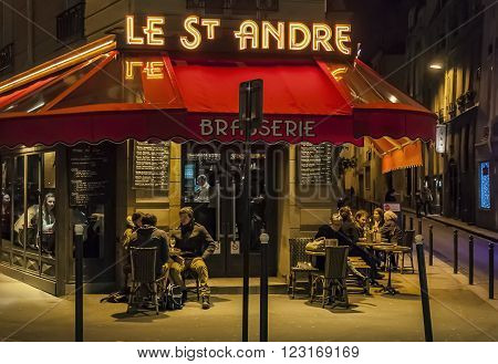 PARIS - MARCH 1: typical Paris cafe with people that enjoy dinner on March 1 2014 in Paris France