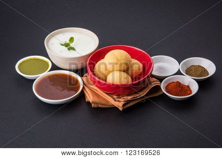 dahi vada or dahi vade also known as Curd Vadai in South India, a popular snack famous all over India prepared by soaking lentil vadas in thick dahi or yogurt, topped with spicy & sweet chutney etc