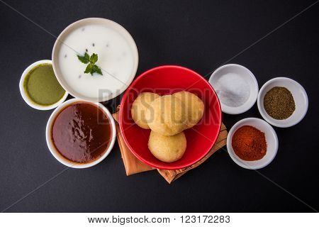 dahi vada or dahi vade also known as Curd Vadai in South India, a popular snack famous all over India prepared by soaking lentil vadas in thick dahi or yogurt, topped with spicy & sweet chutney etc