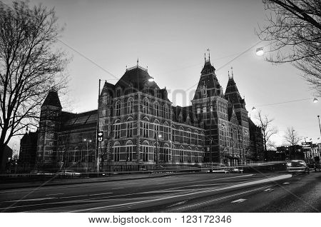 Rijksmuseum in Amsterdam Netherlands. Night view of Dutch national museum which has on display thousands objects of art and history and very popular among tourists. Black and white