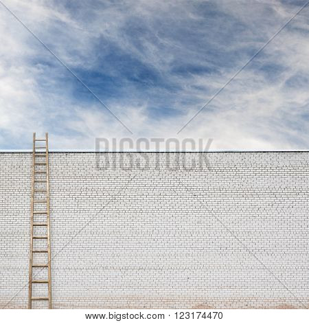huge white brick wall with a wooden ladder and cloudy sky background