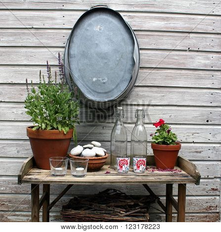 Garde table against a wooden fence in the garden