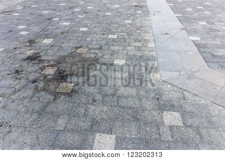 Perspective View of Monotone Gray dirty Brick Stone Street Road. Sidewalk Pavement Texture Background