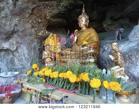 Buddha covered with gold Located in a place called Tham Le Khao Kob Trang.