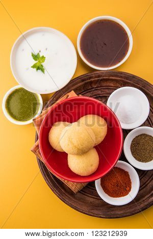 dahi vada or dahi vade also known as Curd Vadai in South India, a popular snack famous all over India prepared by soaking lentil vadas in thick dahi or yogurt, topped with spicy & sweet chutney etc