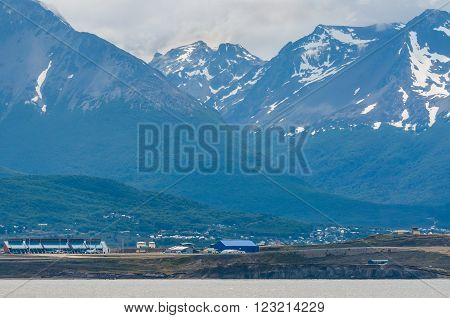 Ushuaia Argentina - December 10 2012: Panoramic views of the Ushuaia Malvinas Argentinas International Airport in the foreground Ushuaia Argentina.