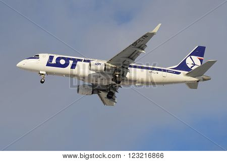 ST. PETERSBURG, RUSSIA - FEBRUARY 17, 2016: The plane Embraer E-170 (SP-LIN) LOT Polish Airlines on approach to Pulkovo airport