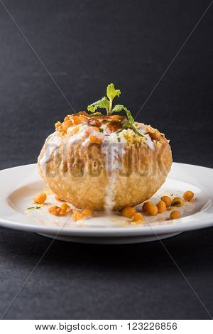 Rajasthani Shahi Raj Kachori, stuffed katchori with potato and sprout filling and served with curd, chutney and sev