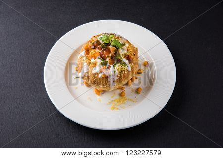 Rajasthani Shahi Raj Kachori, stuffed katchori with potato and sprout filling and served with curd, chutney and sev