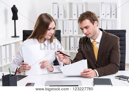 Businessman And Businesswoman At Work