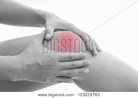 Front view of a young women knee muscle pain. Red around the pain area.