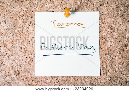 Father's Day Reminder For Tomorrow On Paper Pinned On Cork Board