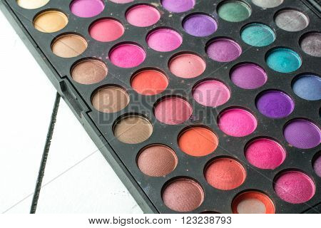 Palette of eyeshadow with many different colors