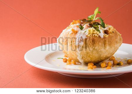 Rajasthani Shahi Raj Kachori, stuffed katchori with potato and sprout filling and served with curd, chutney and sev