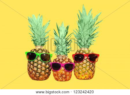 Three Pineapple With Sunglasses On Yellow Background, Colorful Ananas Photo