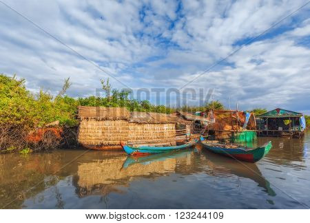 SIEM REAP, CAMBODIA DEC. 16: Cambodian people live on Tonle Sap Lake in Siem Reap, Cambodia on December 16, 2011. The village on the water. Tonle sap lake.