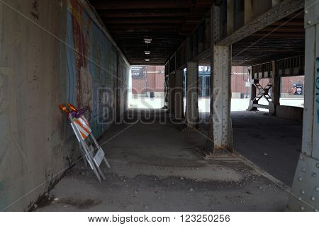 JOLIET, ILLINOIS / UNITED STATES - APRIL 12, 2015: Pedestrians may walk through the Van Buren Street Viaduct in downtown Joliet.