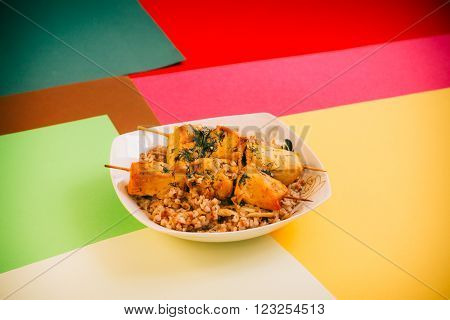 Chicken Barbecue With Buckwheat On The Plate.