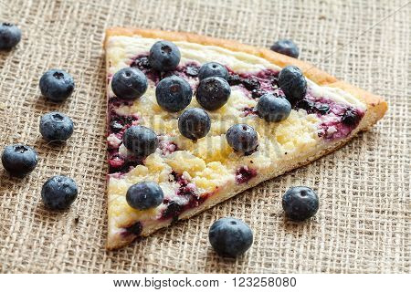 piece of sweet pie with blueberry named Wallachian Frgal. Vlachs' typical cakes, baked in Valassko area, Czech Republic