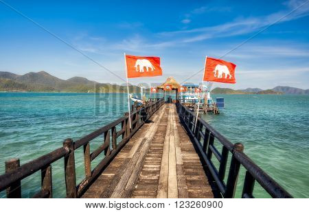 Wooden jetty leading to the moored ship. Koh Laoya Sea of Thailand