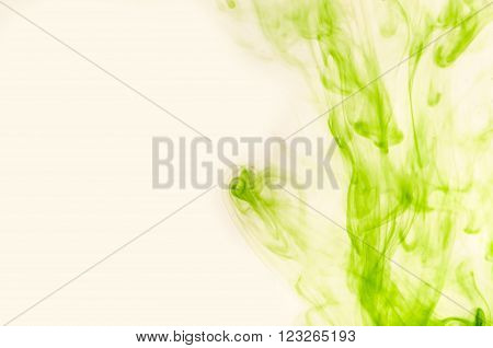 Green air dust soars over a light background