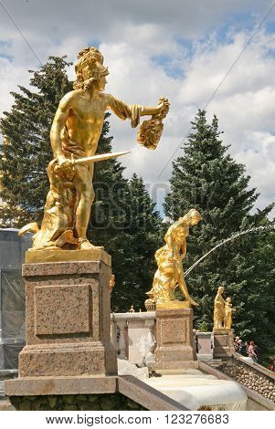 Peterhof, Russia - June 27, 2008: Gold Plated Sculptures By Fountains Grand Cascade In Pertergof, Sa