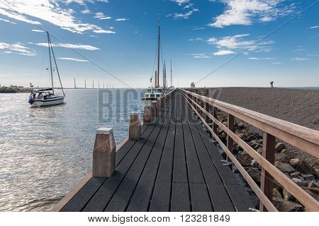 URK, THE NETHERLANDS - AUG 29: A sailing ship with tourists is leaving the harbor of Urk on August 29, 2015 in the harbor of Urk, the Netherlands