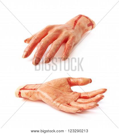 Fake rubber severed hand as a Halloween prank toy, isolated over the white background, set of two different foreshortenings