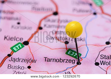 Photo of pinned Tarnobrzeg on a map of Poland. May be used as illustration for traveling theme.