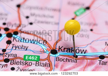 Photo of pinned Bochnia on a map of Poland. May be used as illustration for traveling theme.