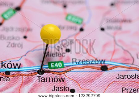 Photo of pinned Tarnow on a map of Poland. May be used as illustration for traveling theme.