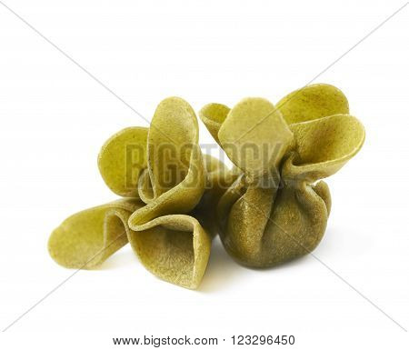 Pile of few sacchettoni stuffed pasta isolated over the white background