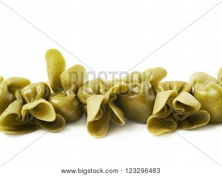 Line of sacchettoni stuffed sacchetti pasta isolated over the white background