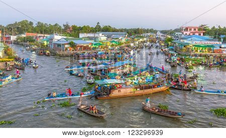 Soc Trang, Vietnam - February 3rd, 2016: scenes dawn dusk floating market trading of farm produce on the day Tet crowded with many boats out on the confluence of the countryside is beautiful in Soc Trang, Vietnam