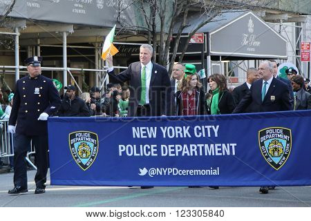 NEW YORK - MARCH 17, 2016: New York's mayor Bill De Blasio (L) and Police Commissioner William Bratton marching at the St. Patrick's Day Parade in New York.