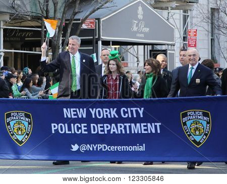 NEW YORK - MARCH 17, 2016: New York's mayor Bill De Blasio (L) and Police Commissioner William Bratton marching at the St. Patrick's Day Parade in New York.