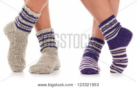Pair of man and woman in the knitted socks over white background
