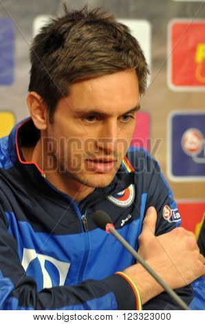 CLUJ-NAPOCA, ROMANIA - MARCH 26, 2016: Goalkeeper of the Romanian National Football Team, Ciprian Tatarusanu speaks during a press conference before the match against Spain