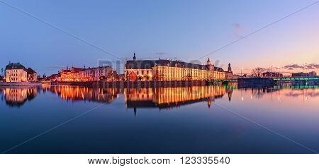 A cityscape of Wroclaw, view from river Odra, in the evening. Poland, Europe. Panorama.