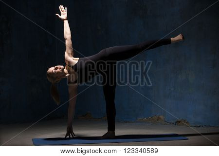 Beautiful Yoga Woman Doing Half Moon Pose