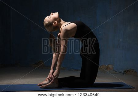 Beautiful Yoga Woman Doing Ustrasana Pose